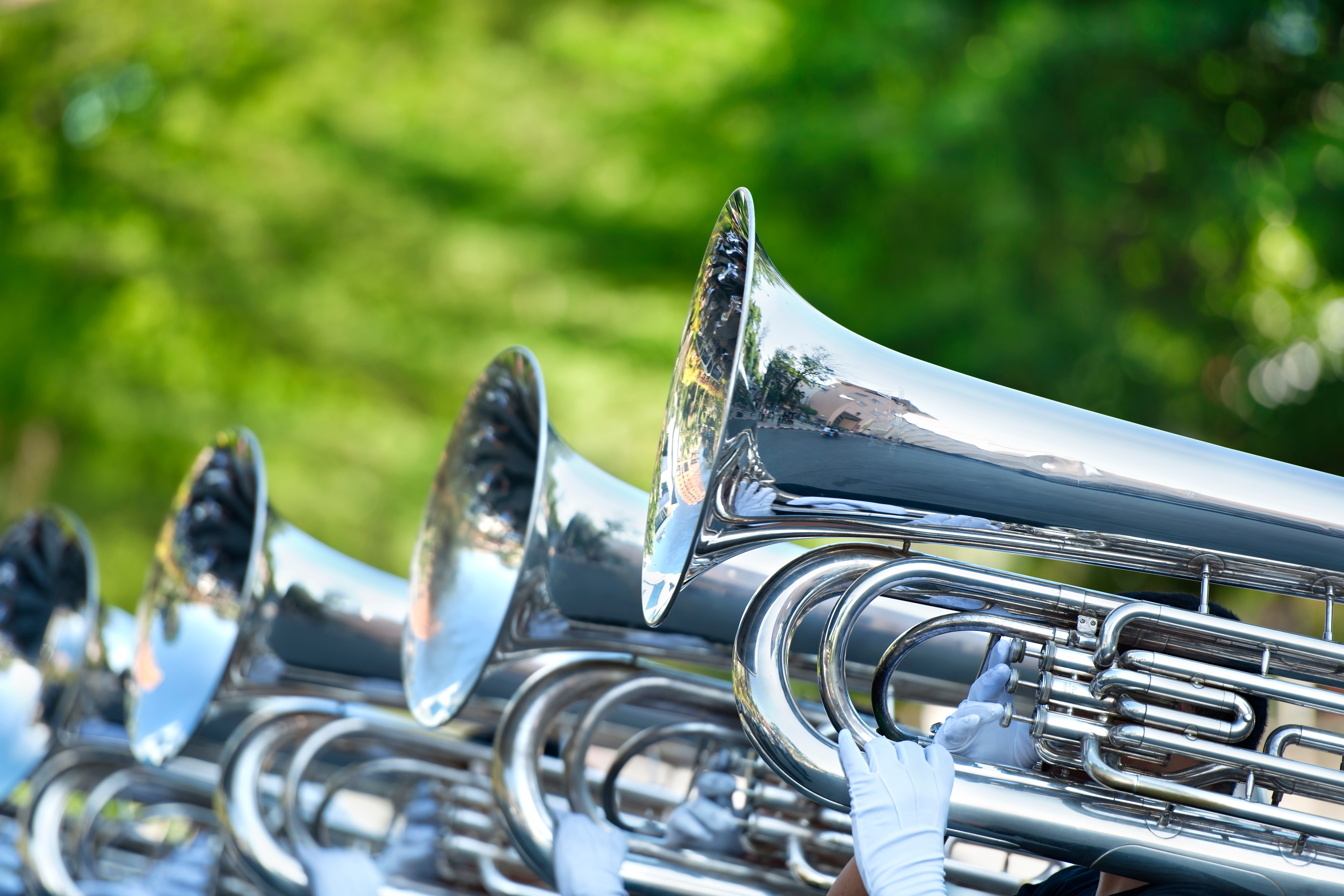 Marching band instruments on a green field